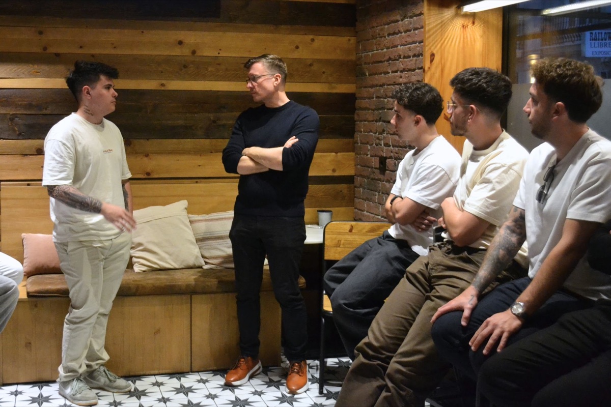 Members talking in small groups at a community meetup